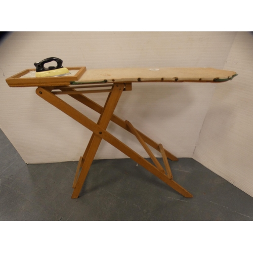 318 - Child's ironing board and iron.