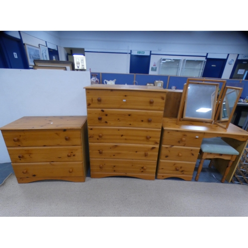 326 - Two pine chests of drawers. a pine dressing table with triple mirror and a dressing stool.