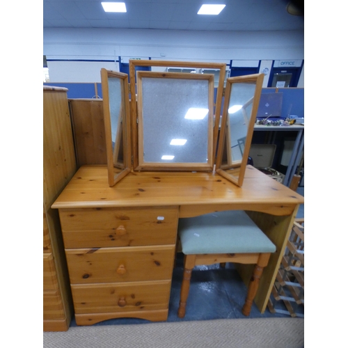 326 - Two pine chests of drawers. a pine dressing table with triple mirror and a dressing stool.