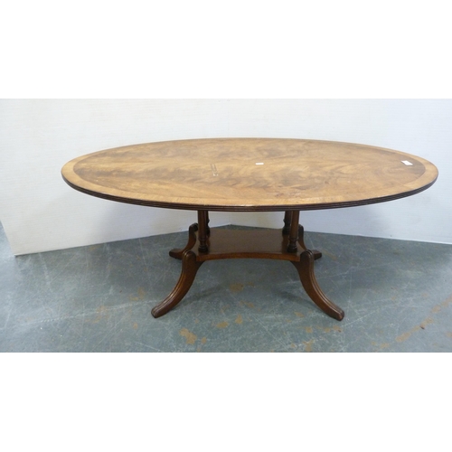 333 - Oval table on quadripartite supports and a rectangular shaped-top table.  (2)