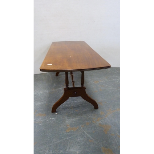 333 - Oval table on quadripartite supports and a rectangular shaped-top table.  (2)