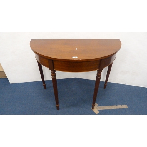 334 - Demi-lune table on fluted supports.