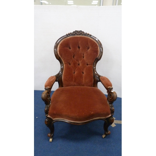 335 - Victorian button-back armchair with pink upholstery, on castors.