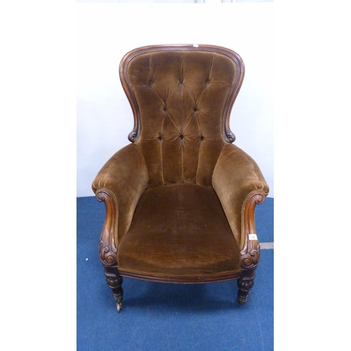 336 - Victorian button-back armchair with brown upholstery, on brass castors.