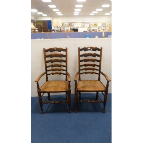 337 - Two ladder-back carver chairs and two similar side chairs.  (4)