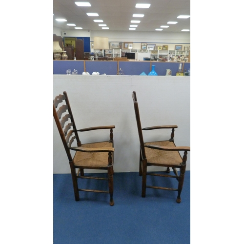 337 - Two ladder-back carver chairs and two similar side chairs.  (4)