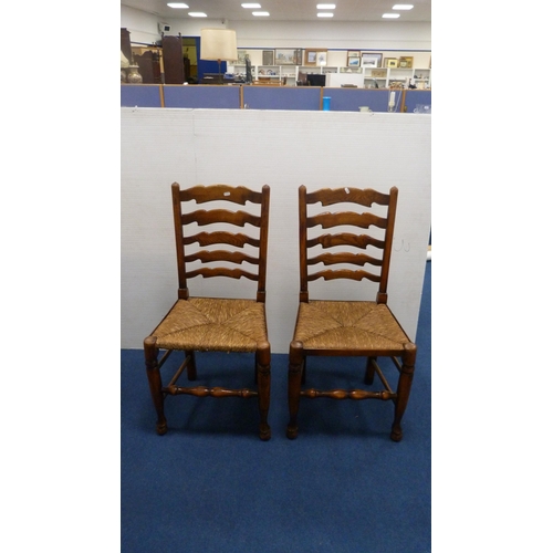 337 - Two ladder-back carver chairs and two similar side chairs.  (4)