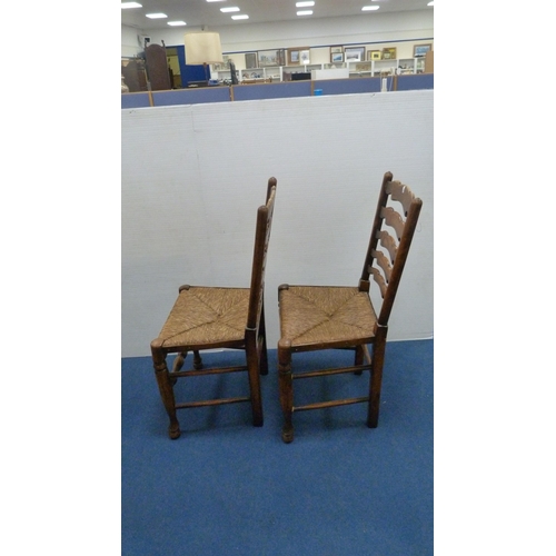 337 - Two ladder-back carver chairs and two similar side chairs.  (4)