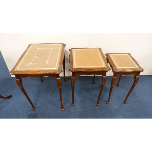 338 - Nest of three tables with brown skivers and glass tops, on pad feet, and a wine table on tripod supp... 