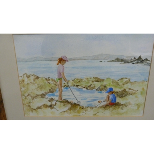 72 - Framed watercolour of two children rockpooling and another.  (2)