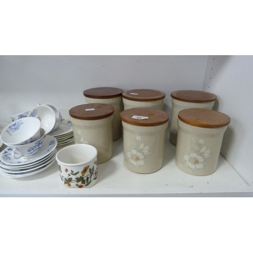 84 - Six Denby storage jars, blue decorated part tea set, four graduated ducks etc (one shelf).