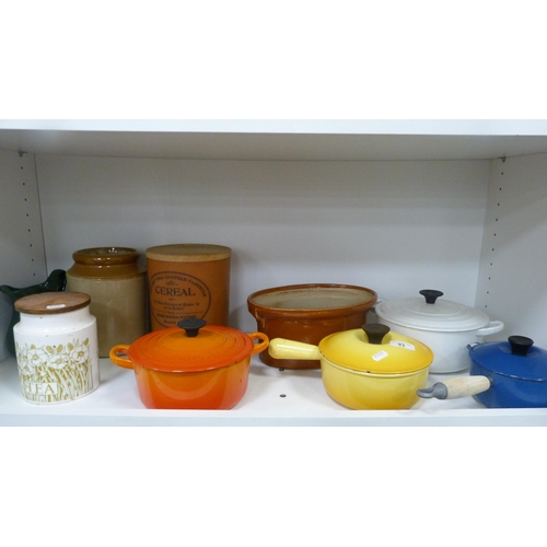 93 - Four Le Creuset pans, various storage jars etc (one shelf).