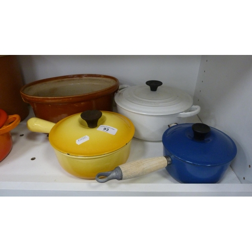 93 - Four Le Creuset pans, various storage jars etc (one shelf).