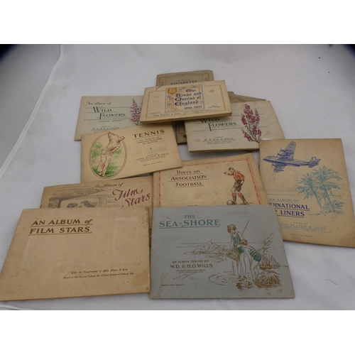 105 - Collection of cigarette card albums to include film stars, airliners, flowers, tennis etc.