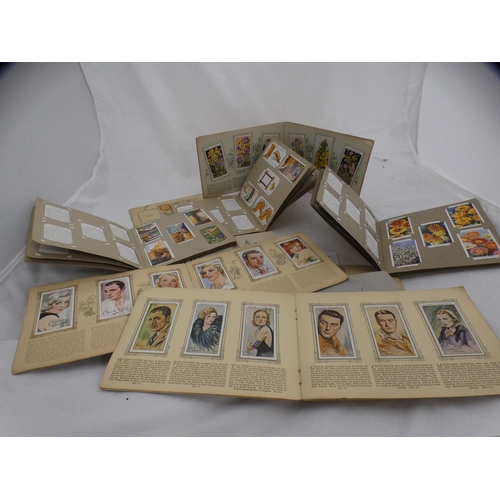 105 - Collection of cigarette card albums to include film stars, airliners, flowers, tennis etc.