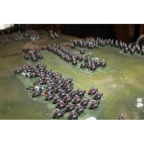 224A - Large diorama of the Battle of Minden, set with painted metal figures, 147cm x 127cm.