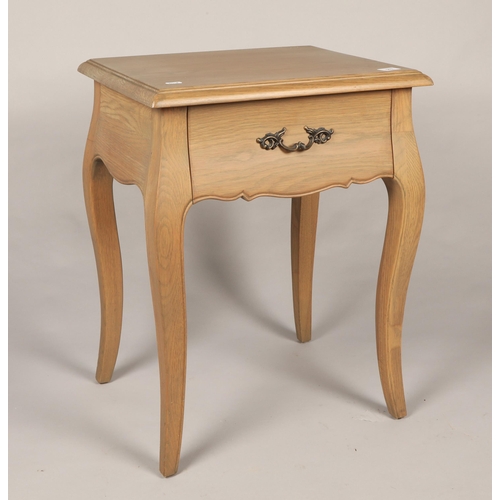 579 - Bleached oak bedside table with fitted drawer