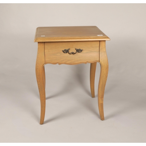 579 - Bleached oak bedside table with fitted drawer