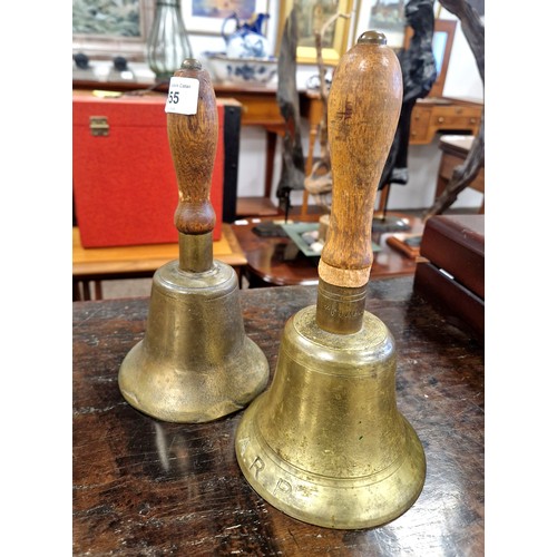 355 - Two brass hand bells, one inscribed ARP and 