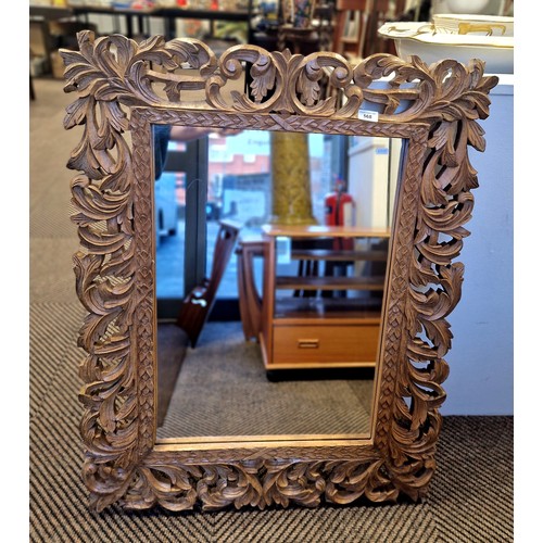 568 - Carved oak framed wall mirror, 80cm x 100cm including the frame