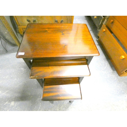 153 - Mahogany nest of three tables.