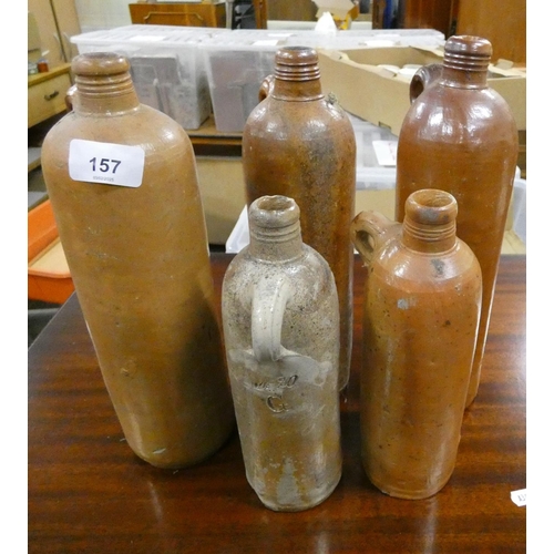 157 - Five antique stoneware bottles.