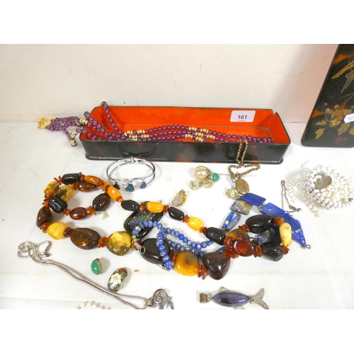 161 - Oriental Laquered glove box containing various costume jewellery to include bids etc.