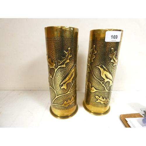 169 - Pair of brass trench art Christmas scene shells, both German 1916-1917 23cm.