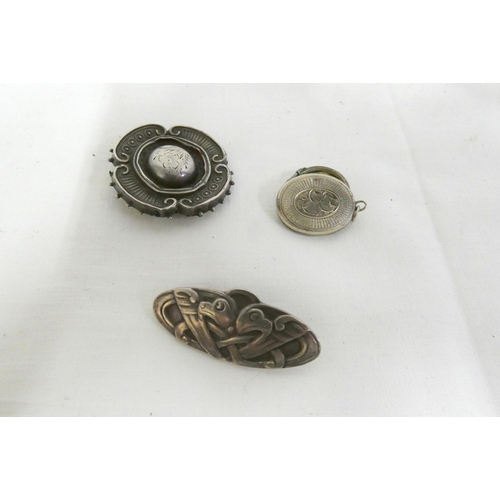 44 - Two silver brooches and silver locket 12.8g