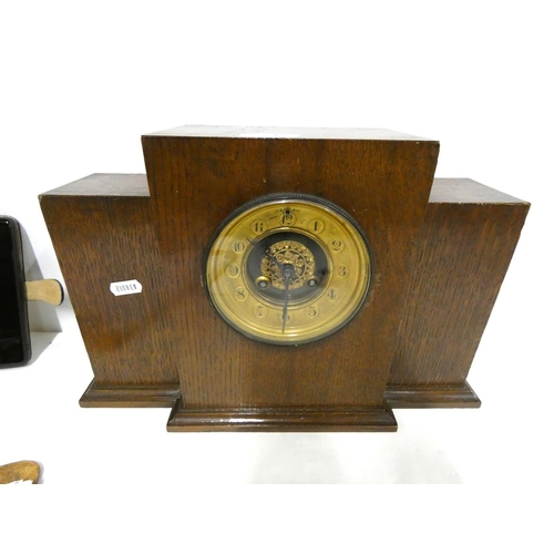 51 - Oak mantel clock of step form with gilt dial.