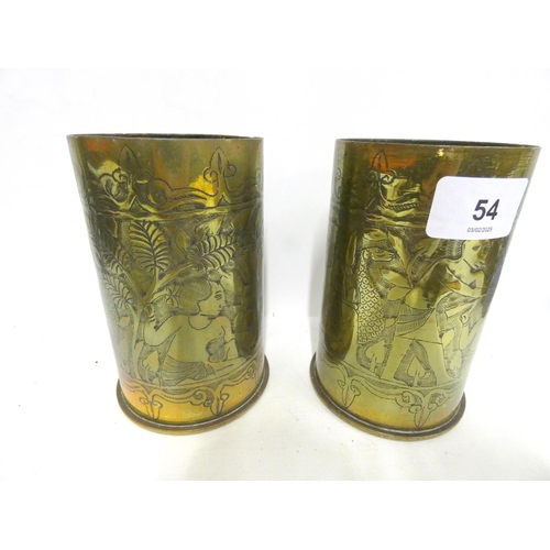 54 - Pair of German brass trench art vases engraved with foliage and animals, 13cm.