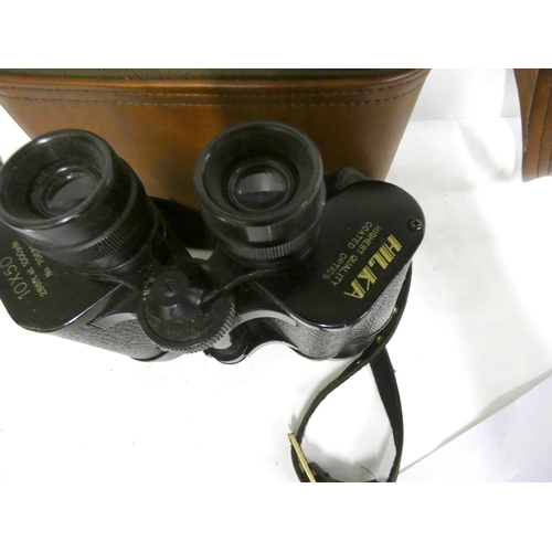 7 - Pair of cased Hilka 10 x 50 binoculars.