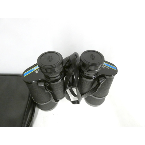 8 - Pair of Tasco 16 x 50 binoculars.