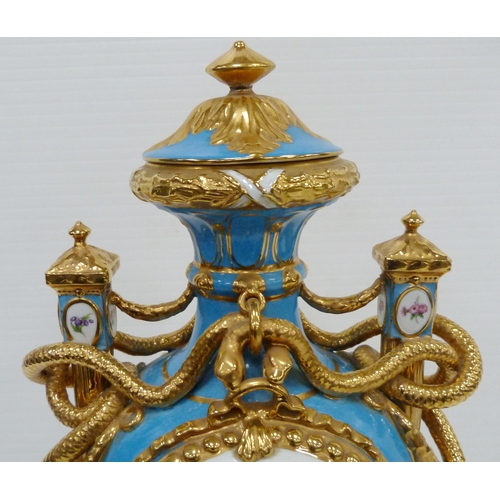 256 - Pair of large porcelain vases and covers decorated with cartouches of flowers and gilded coiled snak... 