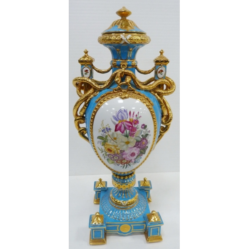 256 - Pair of large porcelain vases and covers decorated with cartouches of flowers and gilded coiled snak... 