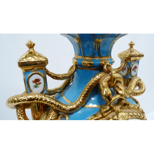 256 - Pair of large porcelain vases and covers decorated with cartouches of flowers and gilded coiled snak... 