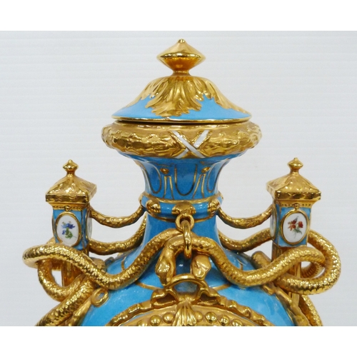 256 - Pair of large porcelain vases and covers decorated with cartouches of flowers and gilded coiled snak... 