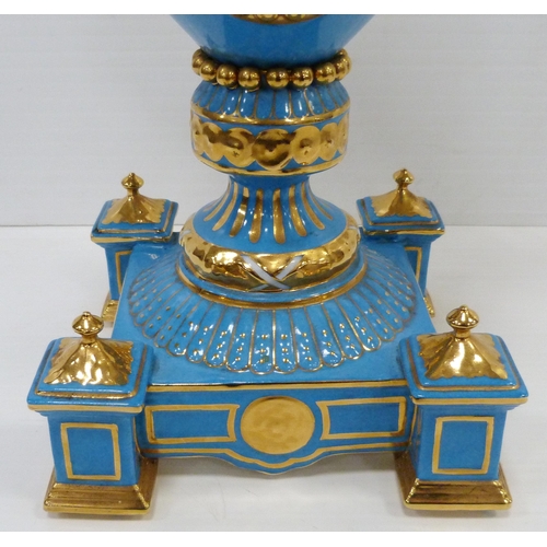 256 - Pair of large porcelain vases and covers decorated with cartouches of flowers and gilded coiled snak... 