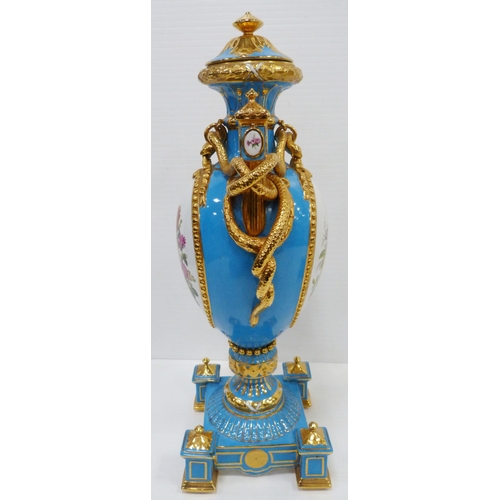 256 - Pair of large porcelain vases and covers decorated with cartouches of flowers and gilded coiled snak... 