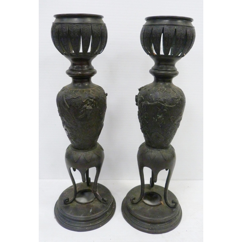 308 - Pair of Japanese cast metal vases of baluster form, Meiji 1868 - 1912, on tripod table supports and ... 