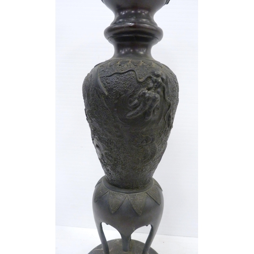 308 - Pair of Japanese cast metal vases of baluster form, Meiji 1868 - 1912, on tripod table supports and ... 