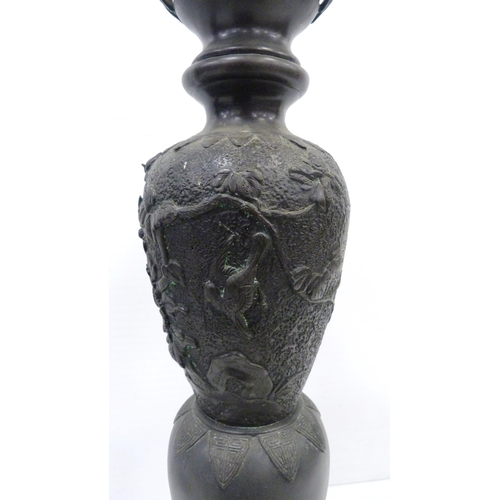 308 - Pair of Japanese cast metal vases of baluster form, Meiji 1868 - 1912, on tripod table supports and ... 