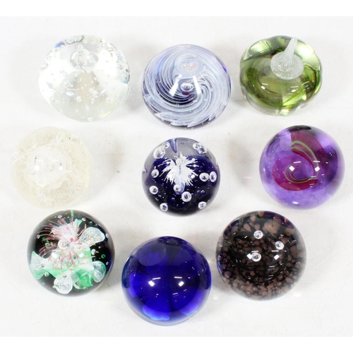 50 - Nine Studio Glass paperweights.