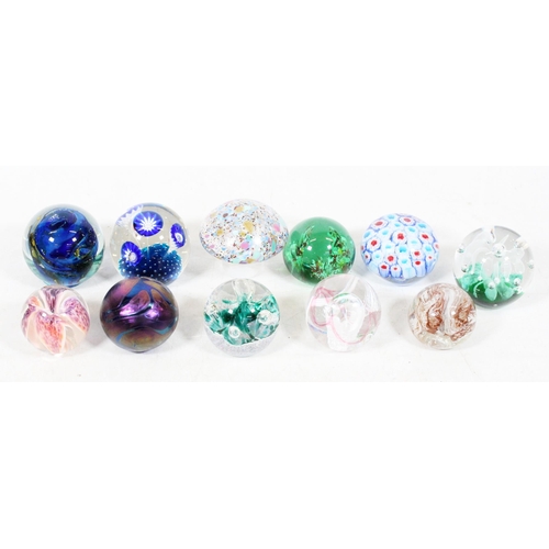 56 - Eleven Art Glass paperweights.