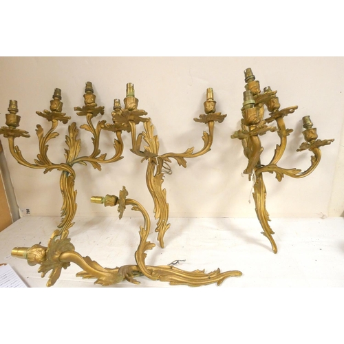 206 - Four antique two branch wall lights.