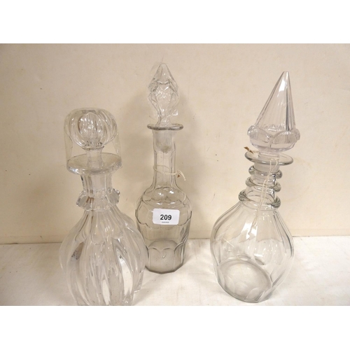 209 - Three art decanters.