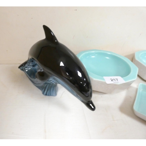 217 - Four pieces of Poole pottery to include dolphin, two bowls, dish etc.