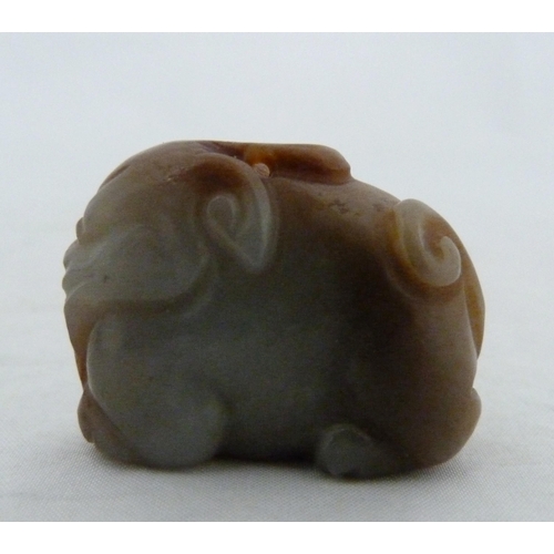 315 - Chinese celadon jade carving of a recumbent kylin, Qing Dynasty, on a padouk stand, 9cm, and another... 