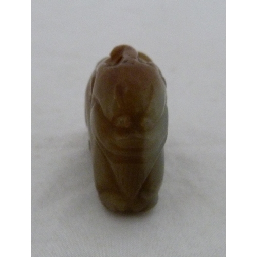 315 - Chinese celadon jade carving of a recumbent kylin, Qing Dynasty, on a padouk stand, 9cm, and another... 
