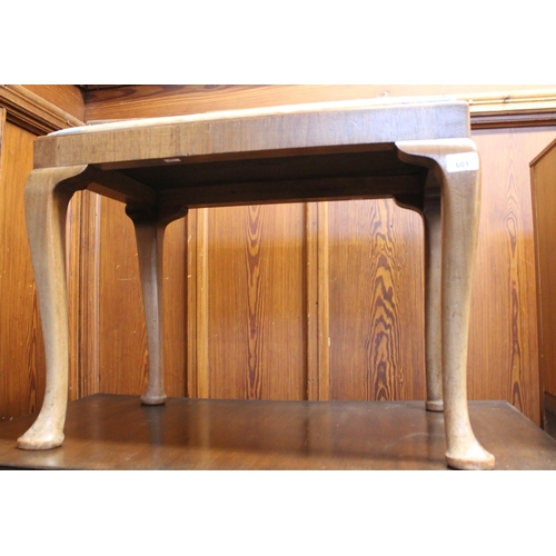 601 - Mahogany footstool raised on cabriole supports.